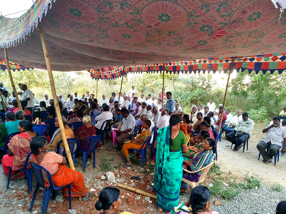 People waiting for their turn to receive medicines at CPI(M) run camp in Vyra Khammam